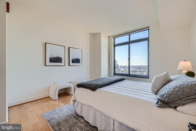 bedroom with light hardwood / wood-style flooring