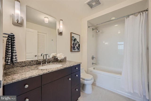 full bathroom with shower / bath combo with shower curtain, tile patterned flooring, vanity, and toilet