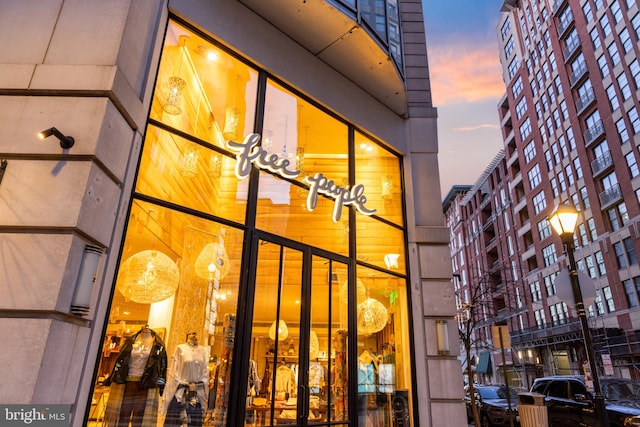 exterior entry at dusk with a balcony