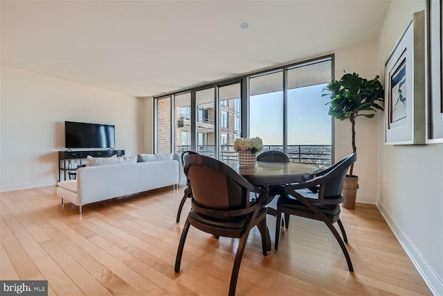 dining space featuring light wood-type flooring