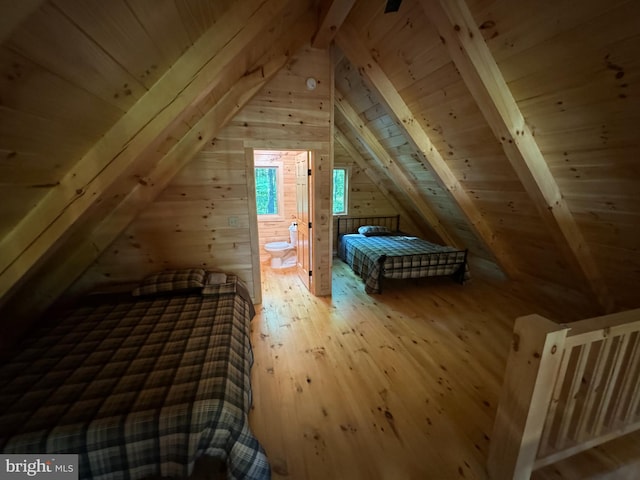 unfurnished bedroom with vaulted ceiling with beams, hardwood / wood-style flooring, wood walls, and wooden ceiling