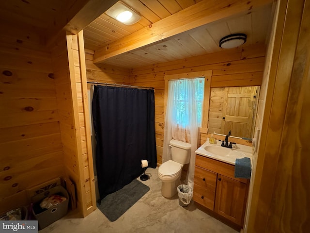 full bath with toilet, vanity, a shower with curtain, wooden walls, and beamed ceiling