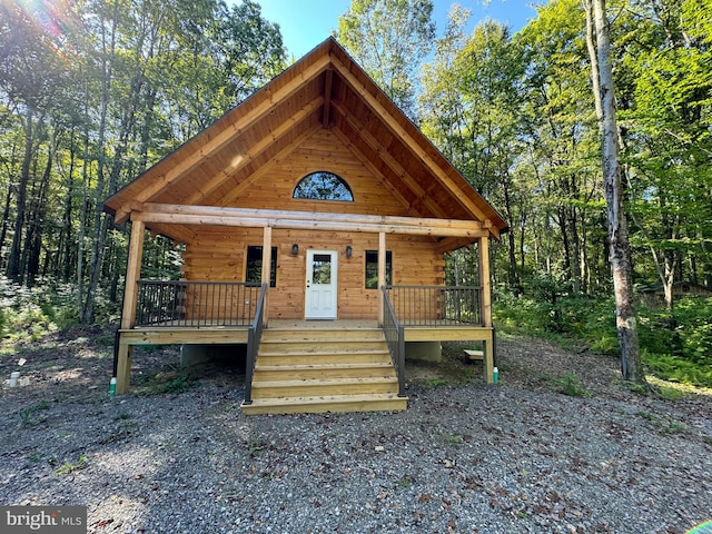 cabin featuring covered porch