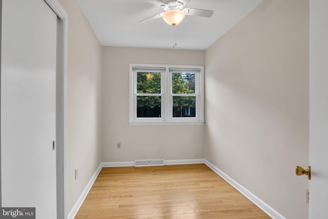 empty room featuring ceiling fan and light hardwood / wood-style floors