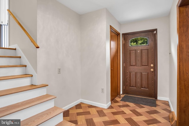 entrance foyer featuring light parquet floors