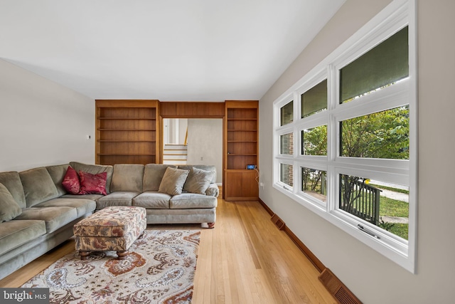 living room with light hardwood / wood-style flooring