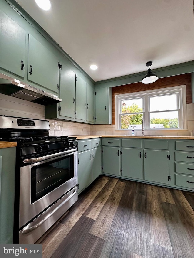 1315 Lexington St, Salisbury, MD 21804 - kitchen with dark wood finished floors, tasteful backsplash, stainless steel range with gas cooktop, and under cabinet range hood