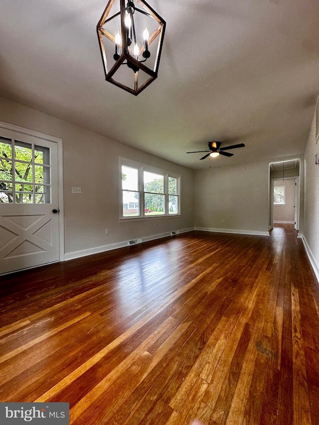1315 Lexington St, Salisbury, MD 21804 - unfurnished living room with attic access, baseboards, ceiling fan with notable chandelier, and dark wood-style flooring