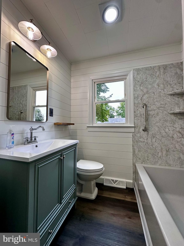 1315 Lexington St, Salisbury, MD 21804 - full bathroom featuring visible vents, toilet, vanity, and wood finished floors