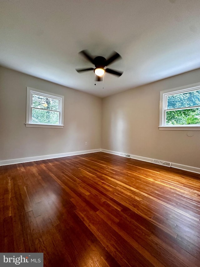 1315 Lexington St, Salisbury, MD 21804 - empty room featuring dark wood finished floors, baseboards, plenty of natural light, and a ceiling fan