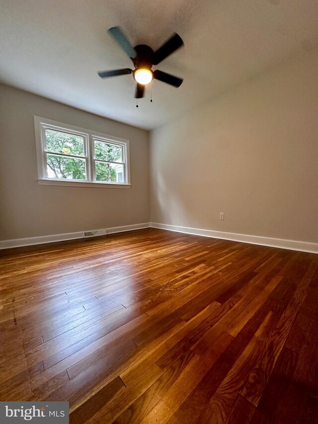 1315 Lexington St, Salisbury, MD 21804 - unfurnished room with baseboards, dark wood-style floors, and a ceiling fan