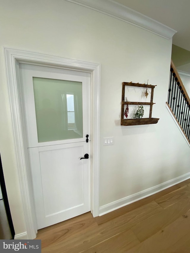 corridor featuring hardwood / wood-style floors