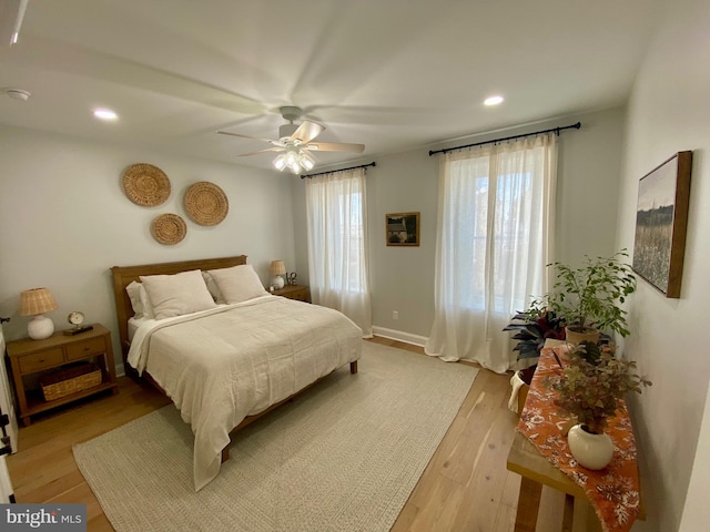 bedroom featuring light hardwood / wood-style floors and ceiling fan