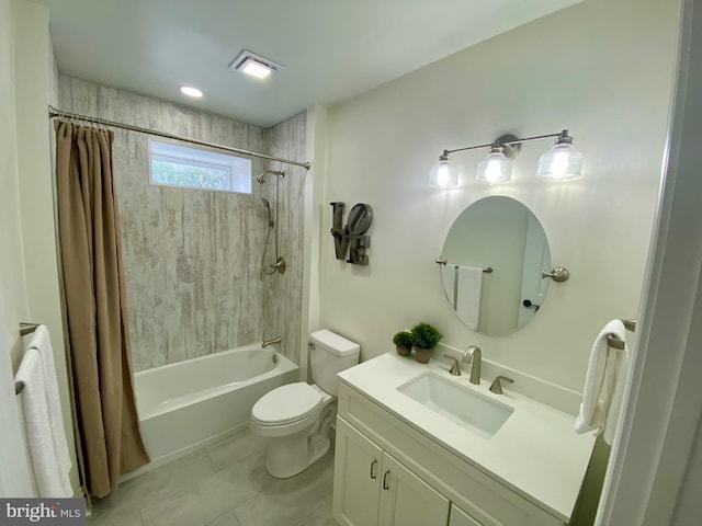 full bathroom featuring vanity, tile patterned flooring, toilet, and shower / bath combo