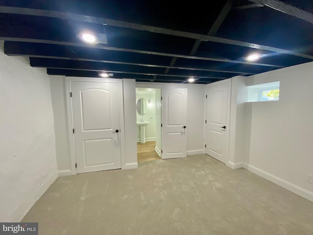 basement with carpet flooring