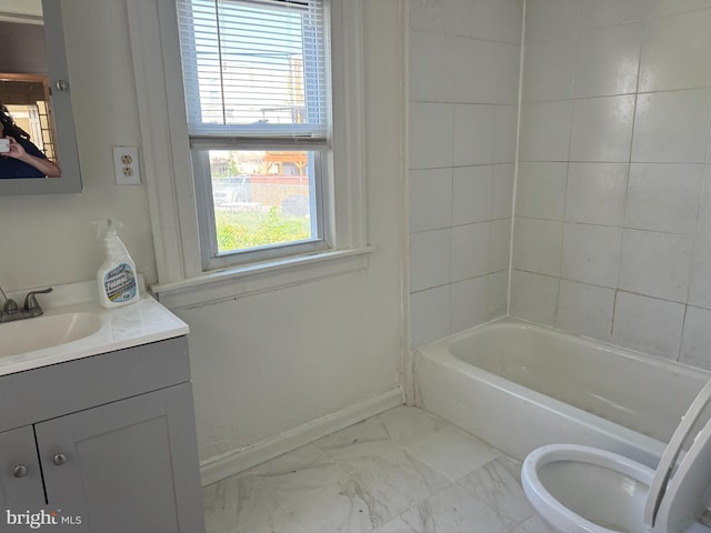 full bathroom featuring vanity, bathing tub / shower combination, and toilet