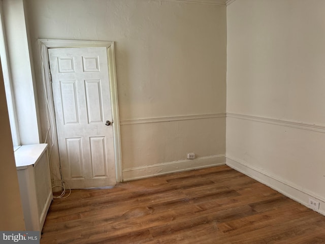 empty room featuring dark wood-type flooring