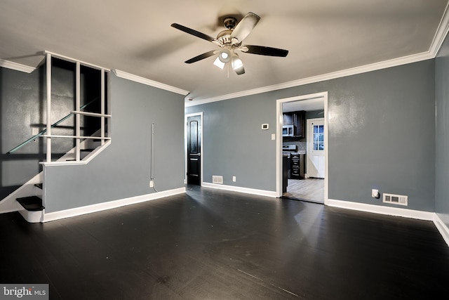 spare room with ornamental molding, dark hardwood / wood-style flooring, and ceiling fan