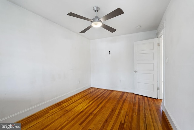 spare room featuring wood-type flooring and ceiling fan