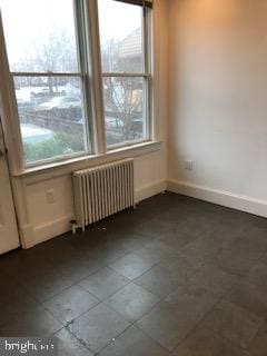 spare room with radiator heating unit