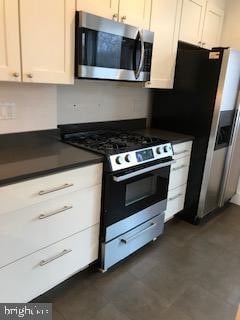 kitchen with white cabinetry and appliances with stainless steel finishes