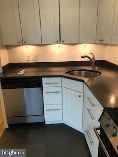 kitchen featuring stainless steel dishwasher, black range with electric cooktop, white cabinets, and sink