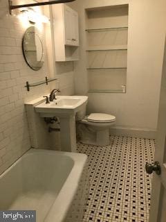 bathroom with a bathtub and toilet