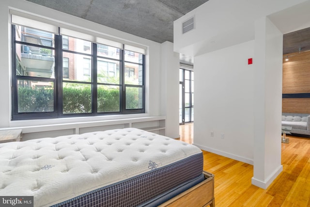 bedroom featuring hardwood / wood-style flooring