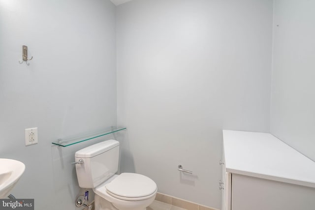 bathroom featuring tile patterned flooring and toilet