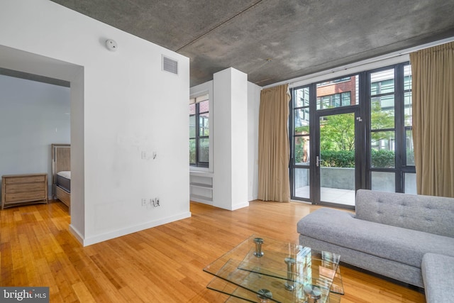 unfurnished living room with hardwood / wood-style flooring