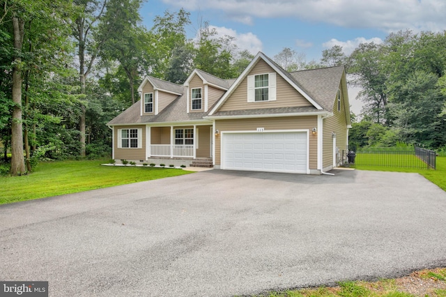 view of front of house with a front yard and a garage