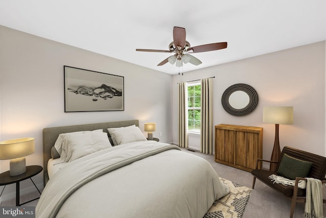 bedroom with ceiling fan and light colored carpet