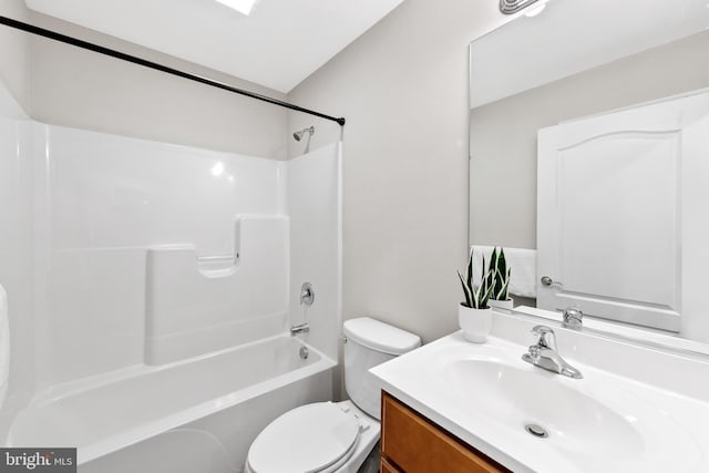 full bathroom with washtub / shower combination, vanity, and toilet