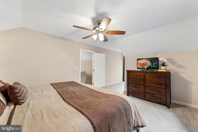 bedroom with lofted ceiling, ceiling fan, and light colored carpet