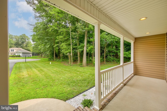 view of yard featuring covered porch