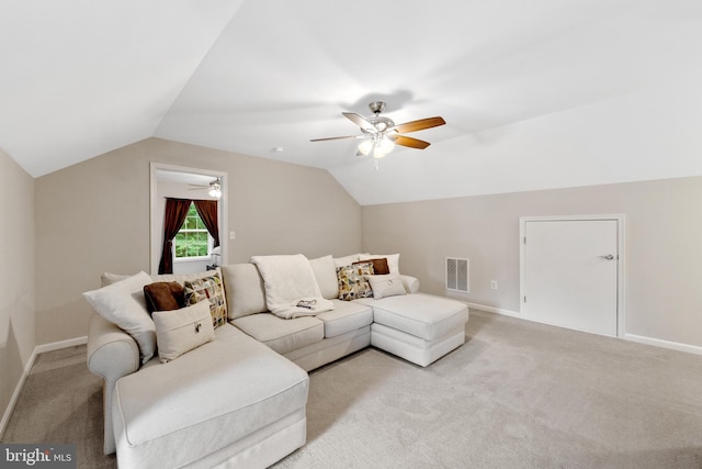 carpeted living room featuring vaulted ceiling and ceiling fan