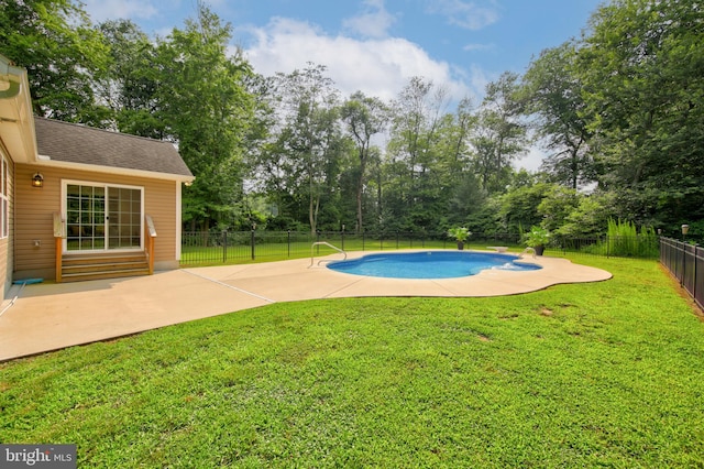 view of swimming pool with a patio and a yard