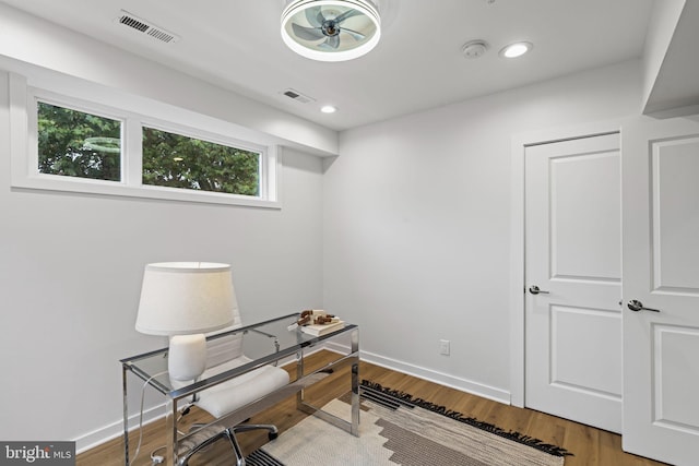 office space featuring ceiling fan and hardwood / wood-style floors