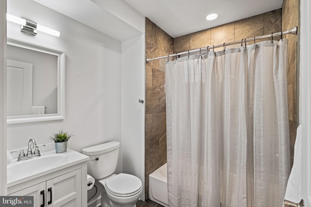 full bathroom featuring shower / tub combo with curtain, vanity, and toilet