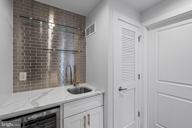 interior space with wine cooler and vanity