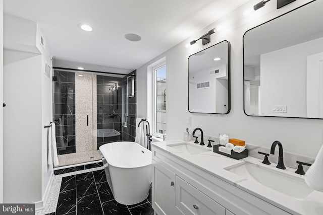 bathroom featuring independent shower and bath and vanity