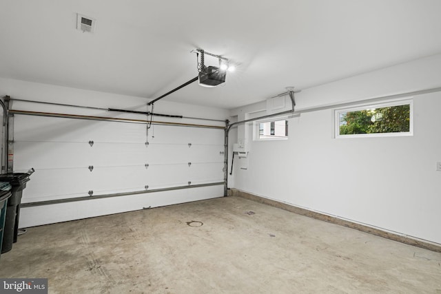 garage featuring a garage door opener