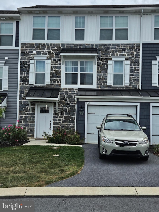 multi unit property featuring a garage