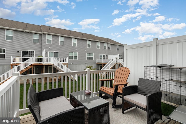 wooden deck with outdoor lounge area