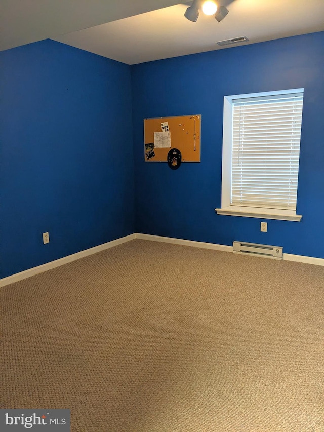 unfurnished room featuring ceiling fan, carpet flooring, and a baseboard radiator