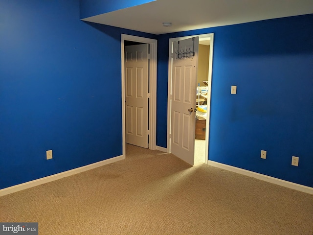 unfurnished bedroom featuring carpet