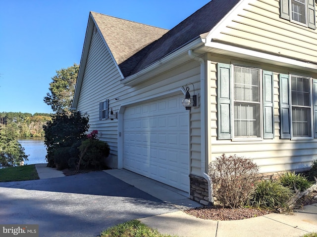 view of side of property with a garage