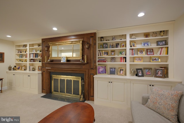 living room with light carpet and built in features