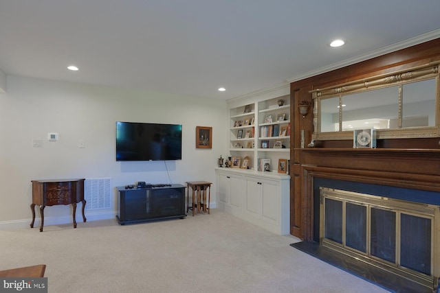 carpeted living room with built in features