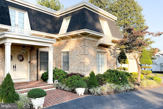 view of exterior entry featuring a porch